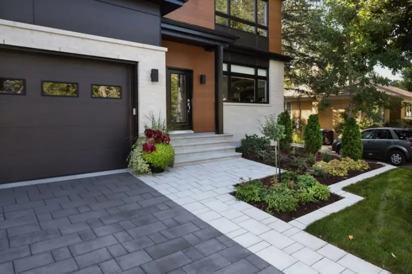 Front yard interlock walkway and driveway with garden